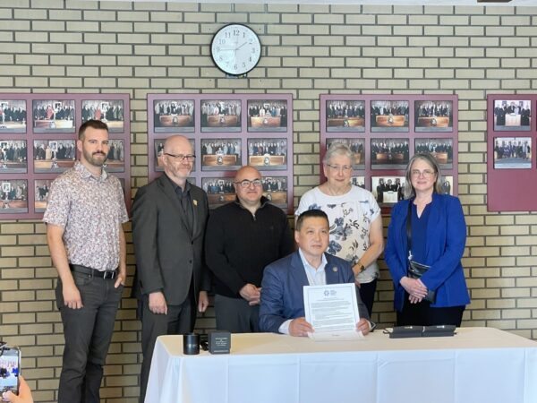 City of PG sign statement of support for the Human Trafficking Network of BC