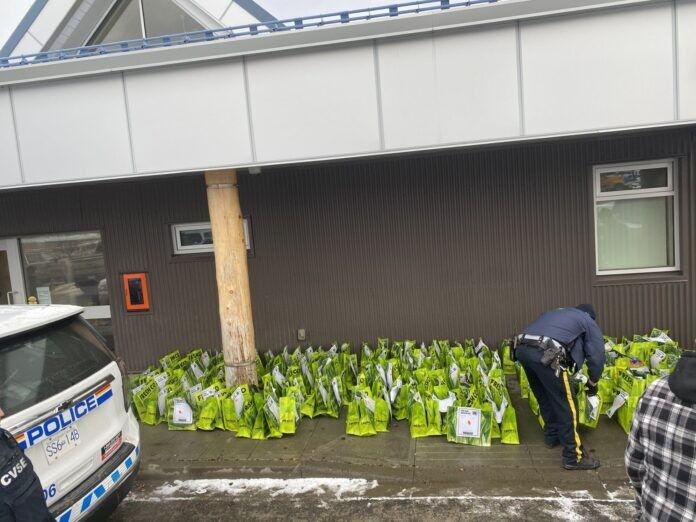 100 Mile House RCMP collecting donations for the Food Bank & Loaves and Fishes