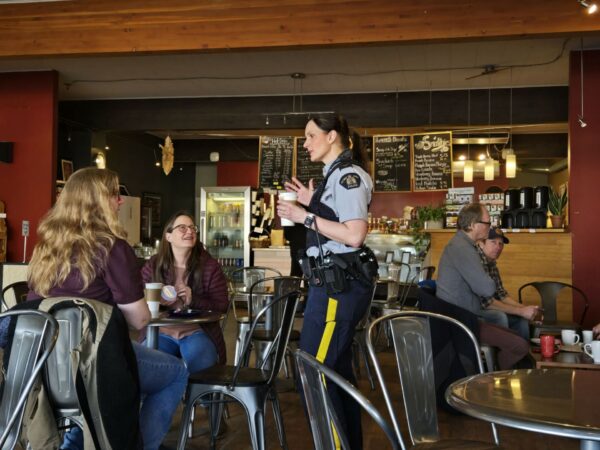 PG RCMP chat with seniors about scams over coffee